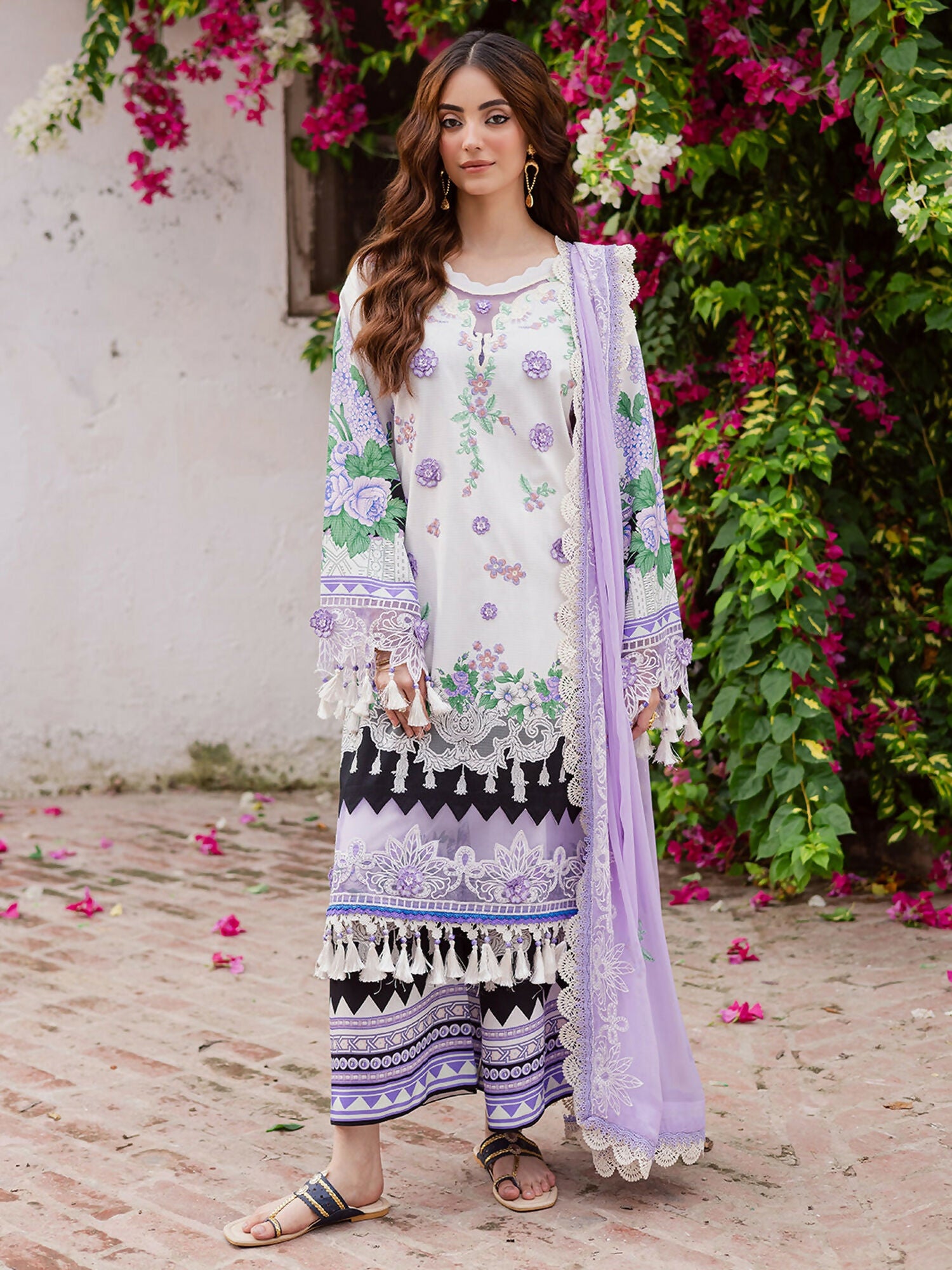 Three-piece unstitched dress set featuring a printed and embroidered shirt with 3D motif and embroidered border – embroidered chiffon dupatta – 2.65 yards – printed trouser – 2.65 yards