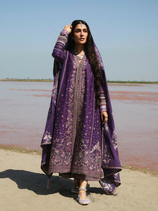 Deep purple embroidered lawn shirt with intricate patterns on bodice and sleeves, matching cotton trousers, and printed lawn dupatta for a coordinated festive look.