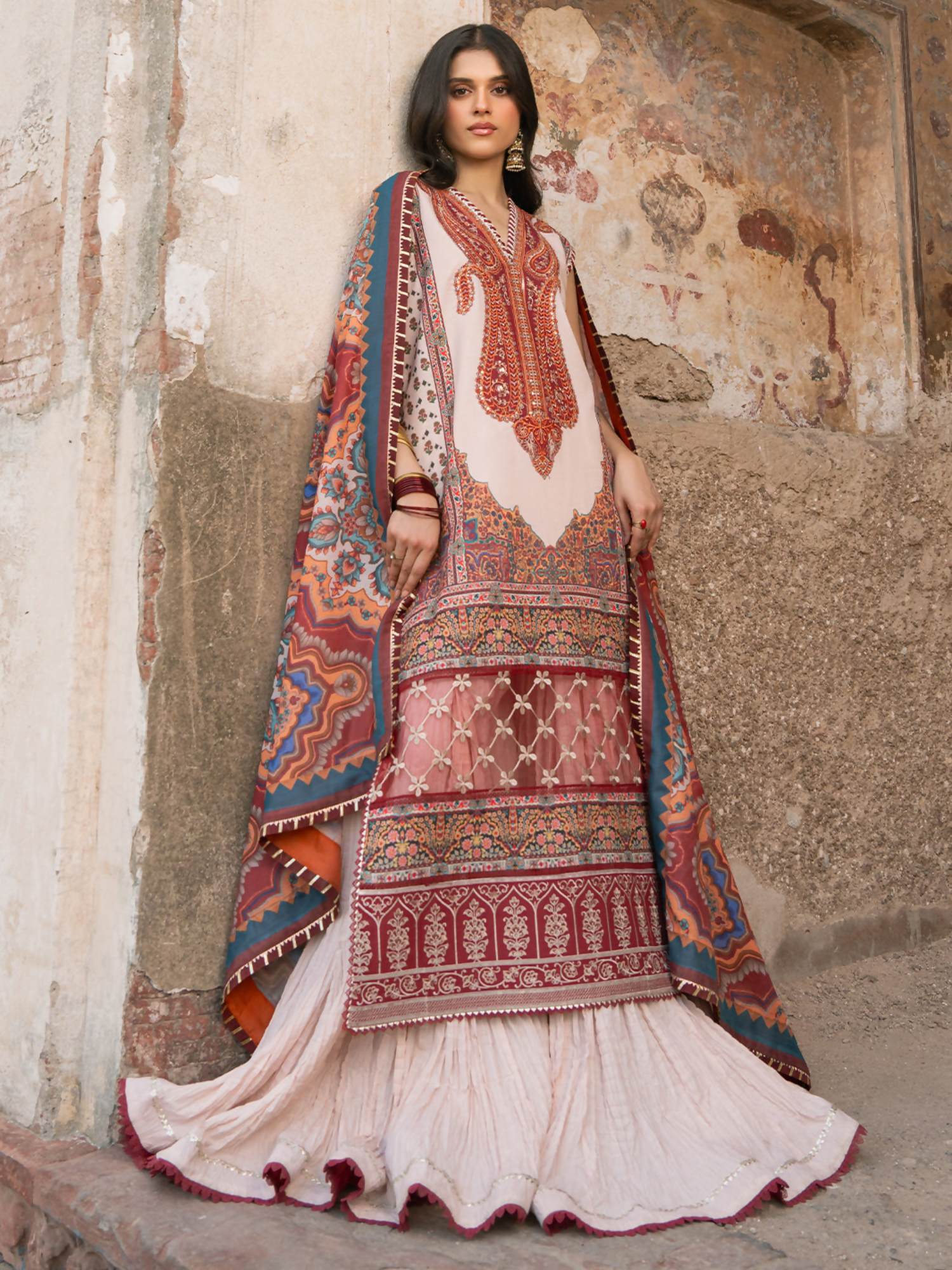 Digital printed 3-piece unstitched suit with embroidered neck and lace detailing, paired with chiffon dupatta and cotton trouser.