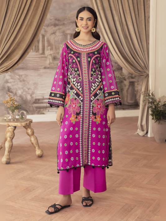 Woman wearing a magenta unstitched 2 piece lawn suit with multi-colored printed shirt and matching cotton trouser.