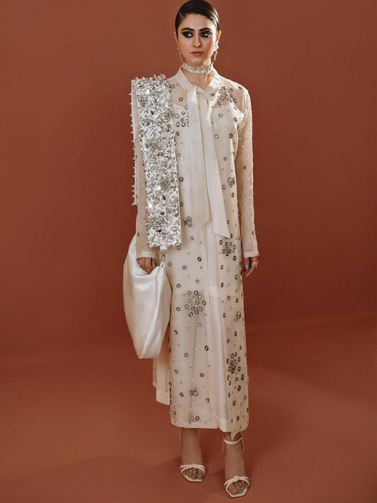White long organza jacket outfit with silver embellishments, straight pants, and organza dupatta by Hussain Rehar.