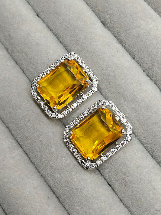 H&A Jewellery stud earrings with rectangular yellow stones surrounded by zircon accents.