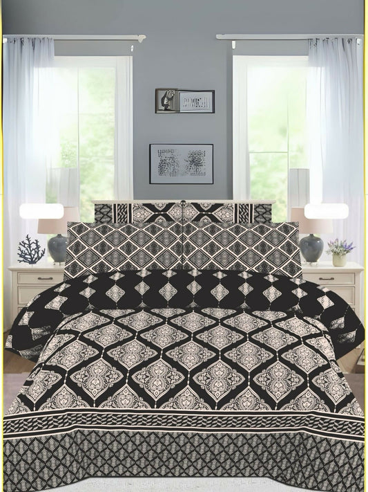 A black king-size bedsheet set with elegant white design patterns, paired with matching pillow covers, neatly spread on a bed.