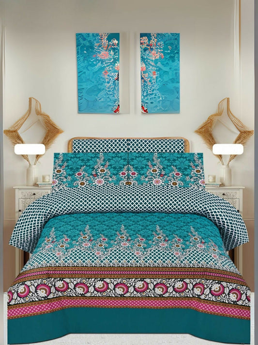 A king-size bedsheet set featuring a vibrant mix of teal, pink, and white geometric and floral patterns, paired with matching pillow covers, displayed neatly on a bed.