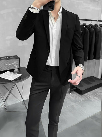 Man wearing a Luxe Crest Black Business Coat with tailored silhouette and crest embellishment, perfect for formal and office wear
