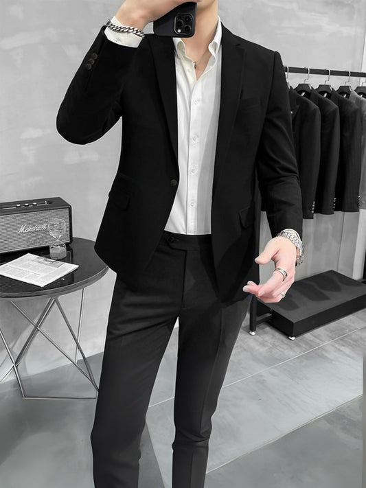 Man wearing a Luxe Crest Black Business Coat with tailored silhouette and crest embellishment, perfect for formal and office wear