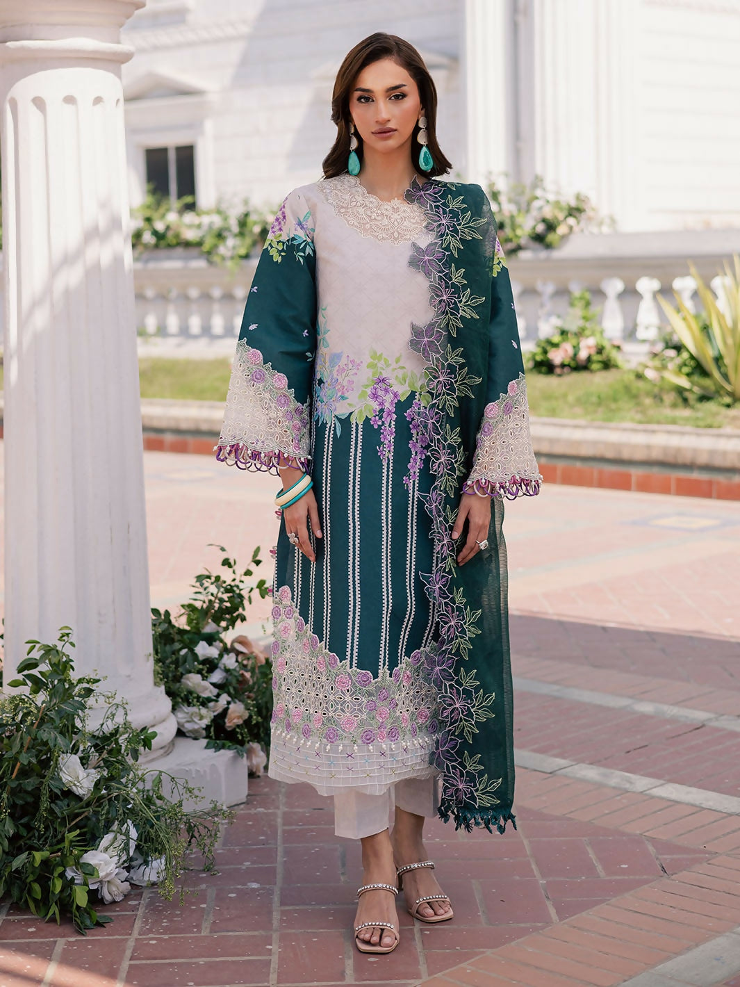 Unstitched 3-piece suit with printed lawn shirt, embroidered net dupatta, and printed cambric trouser.