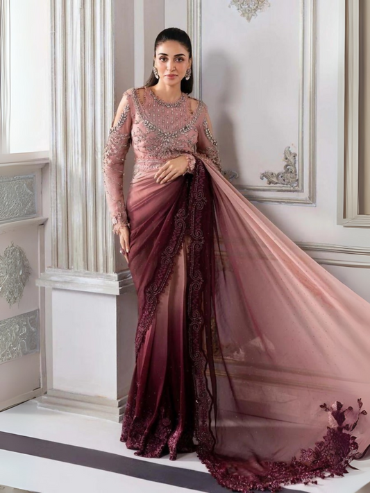 Woman wearing a luxury unstitched chiffon saree with embroidered and diamante-detailed pallu, embellished blouse, and printed raw silk petticoat.
