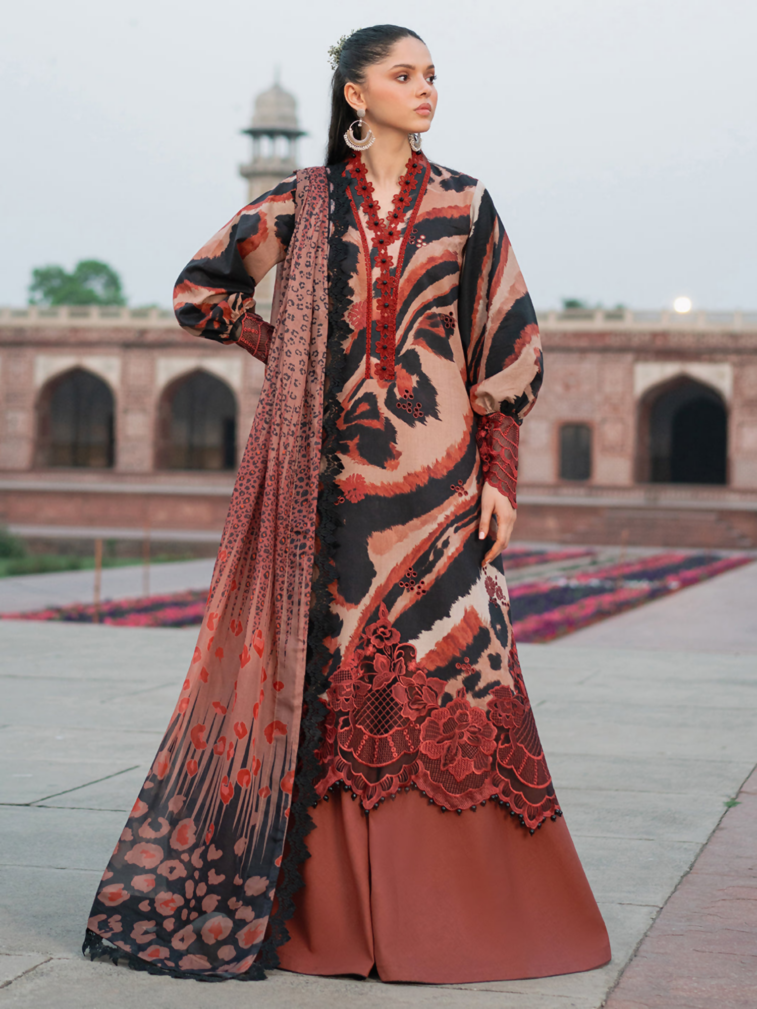 Embroidered digital printed shirt with organza sleeve and daman lace, paired with chiffon dupatta and dyed cotton trouser.
