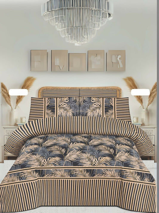 A beige king size bedsheet with black and beige leaf pattern, styled on a bed with matching pillow covers.