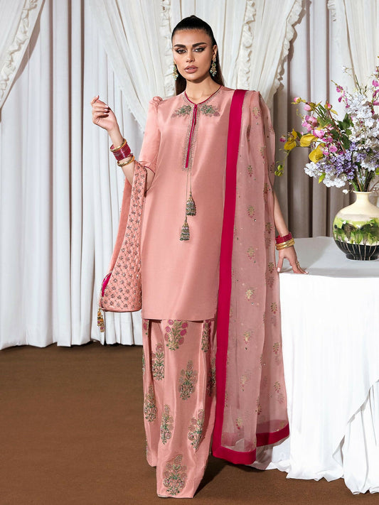 Light pink raw silk stitched 3-piece suit Incarnat by HussainRehar featuring an embellished neckline with bugle beads, nakshi, dabka, sequins, tassels and puffed sleeves, paired with a block-printed raw silk shalwar with matching embellishments and a block-printed organza dupatta sprayed with gold sequins and finished with a shocking pink satin silk border