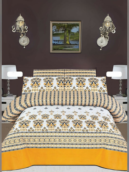 White bedsheet with yellow and black design pattern neatly spread on a bed with matching pillow covers.