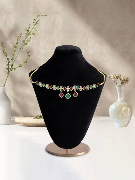 Glitter Jewellery gold-toned choker necklace with multicolor stones and dangling accents displayed on a black mannequin.