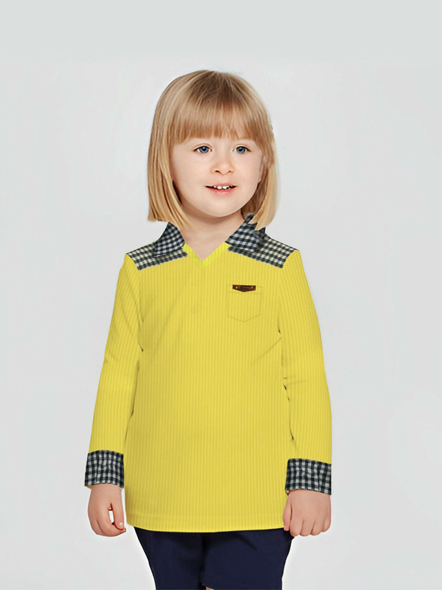 Girls' long-sleeve navy check cotton shirt with contrast collar and cuffs, featuring a chest pocket with badge.