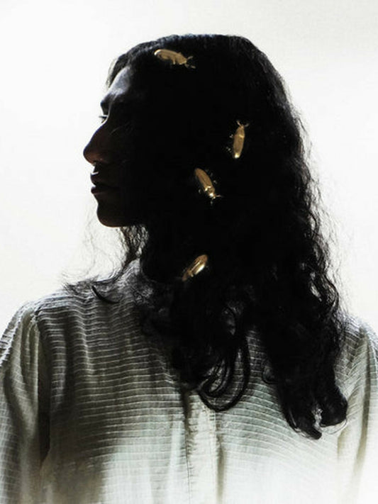Jugnu by Hussain Rehar golden Jugnu hairpin inspired by fireflies with shimmering detailing, elegant radiant hair accessory.