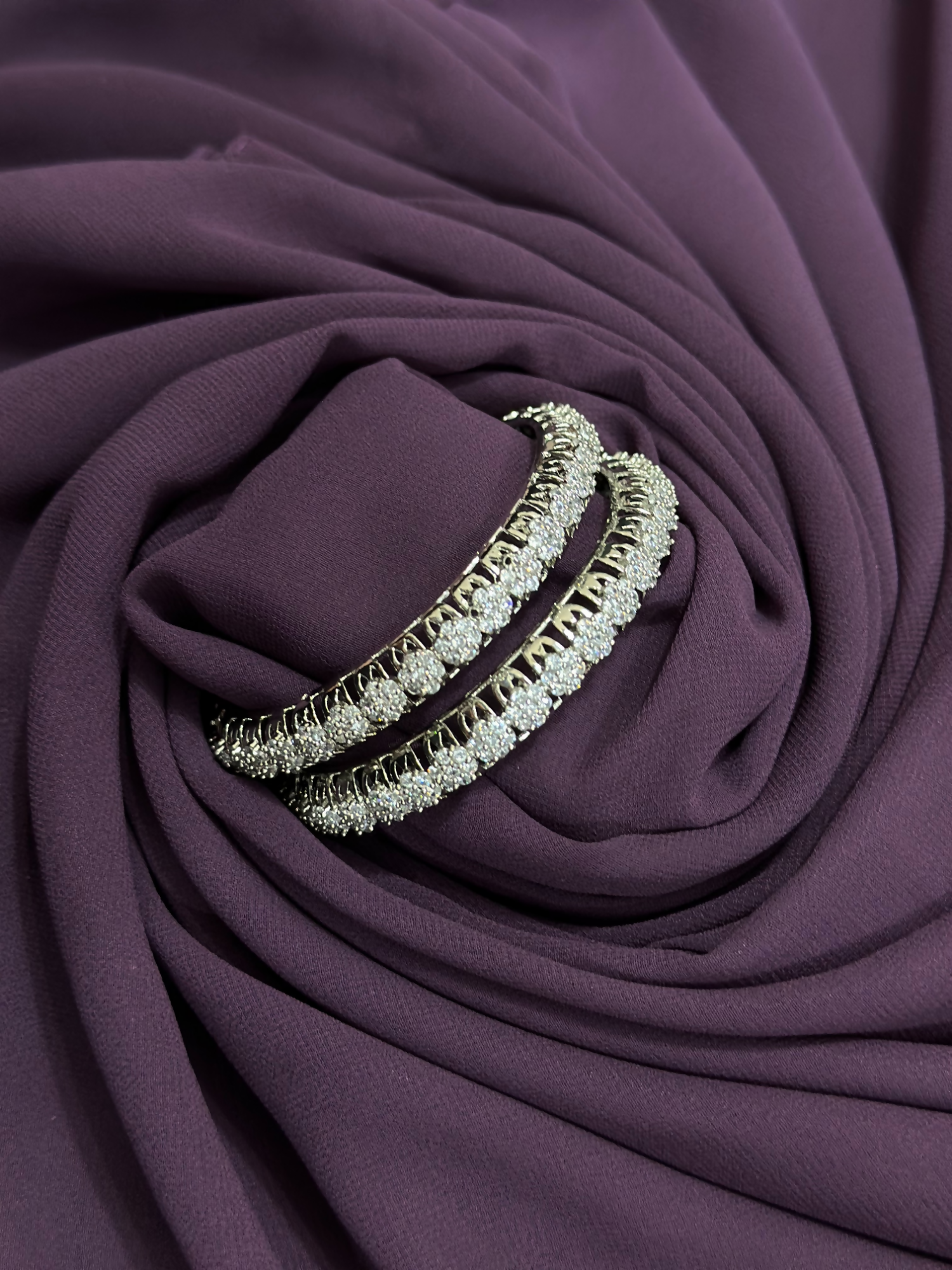 Pair of metallic bangles featuring round-cut white imitation crystals in a full-circle design – 2.25-inch size from Glitter Jewellery.