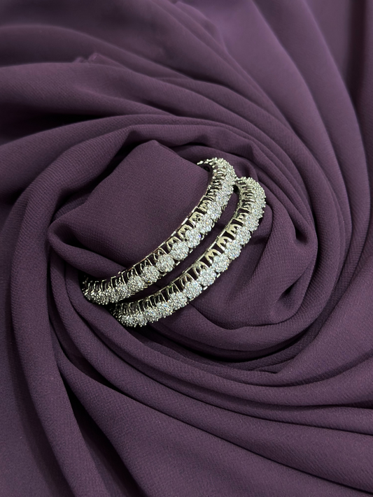 Pair of metallic bangles featuring round-cut white imitation crystals in a full-circle design – 2.25-inch size from Glitter Jewellery.