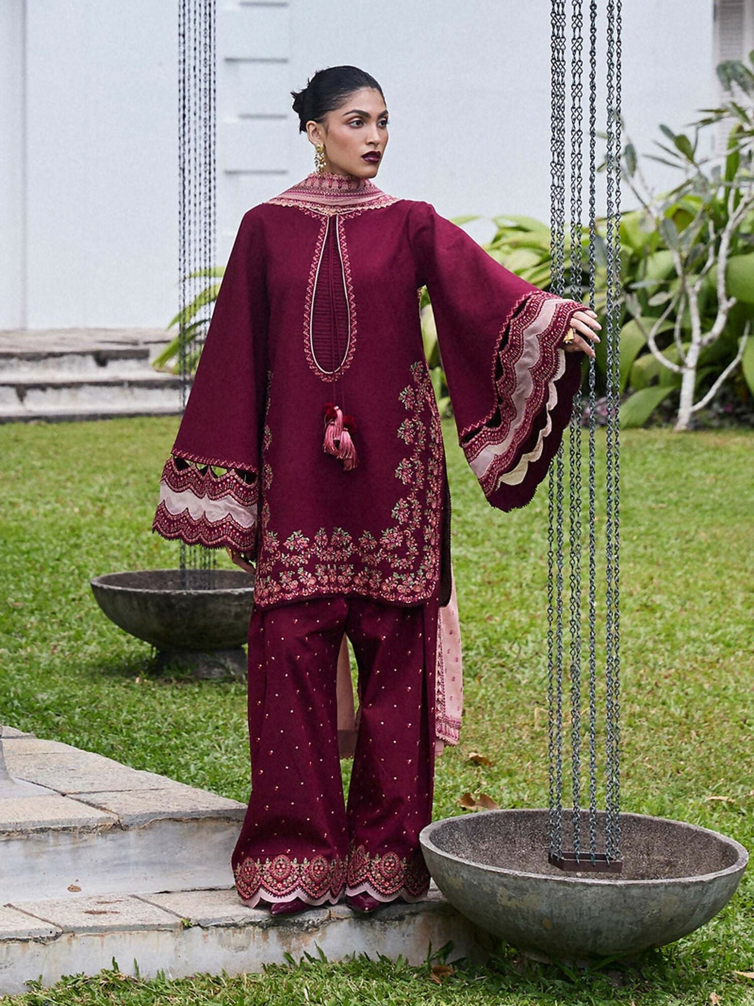 Deep maroon jacquard lawn shirt with bell sleeves, scalloped cotton shalwar with organza detailing, paired with a light pink embroidered lawn dupatta.