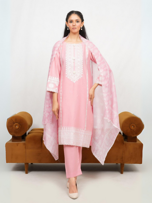 Woman wearing stitched 3-piece suit with exquisite sequence embroidery on straight-cut shirt, finely detailed craftsmanship, digitally printed dupatta, and matching wide-leg trouser.