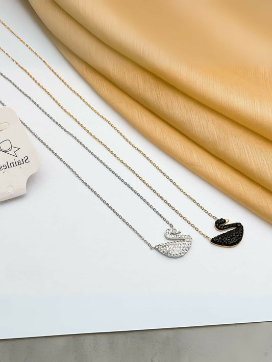 Noor Bilal stainless steel locket chain with swan pendants in silver and black finish.