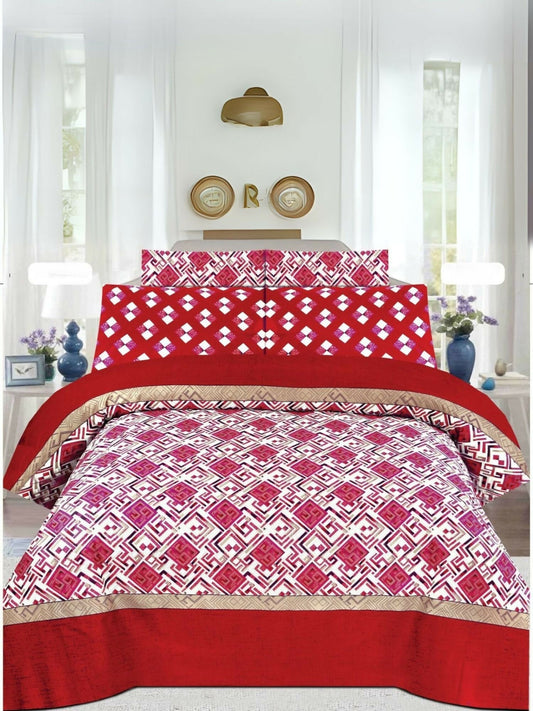 A red bedsheet with white printed design, laid flat with matching pillow covers.