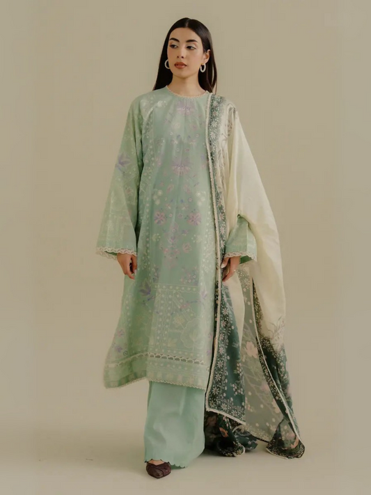 Unstitched 3-piece embroidered suit featuring a mint green embroidered lawn shirt, dyed cambric trouser, and digital printed silk dupatta for a refined, elegant look.