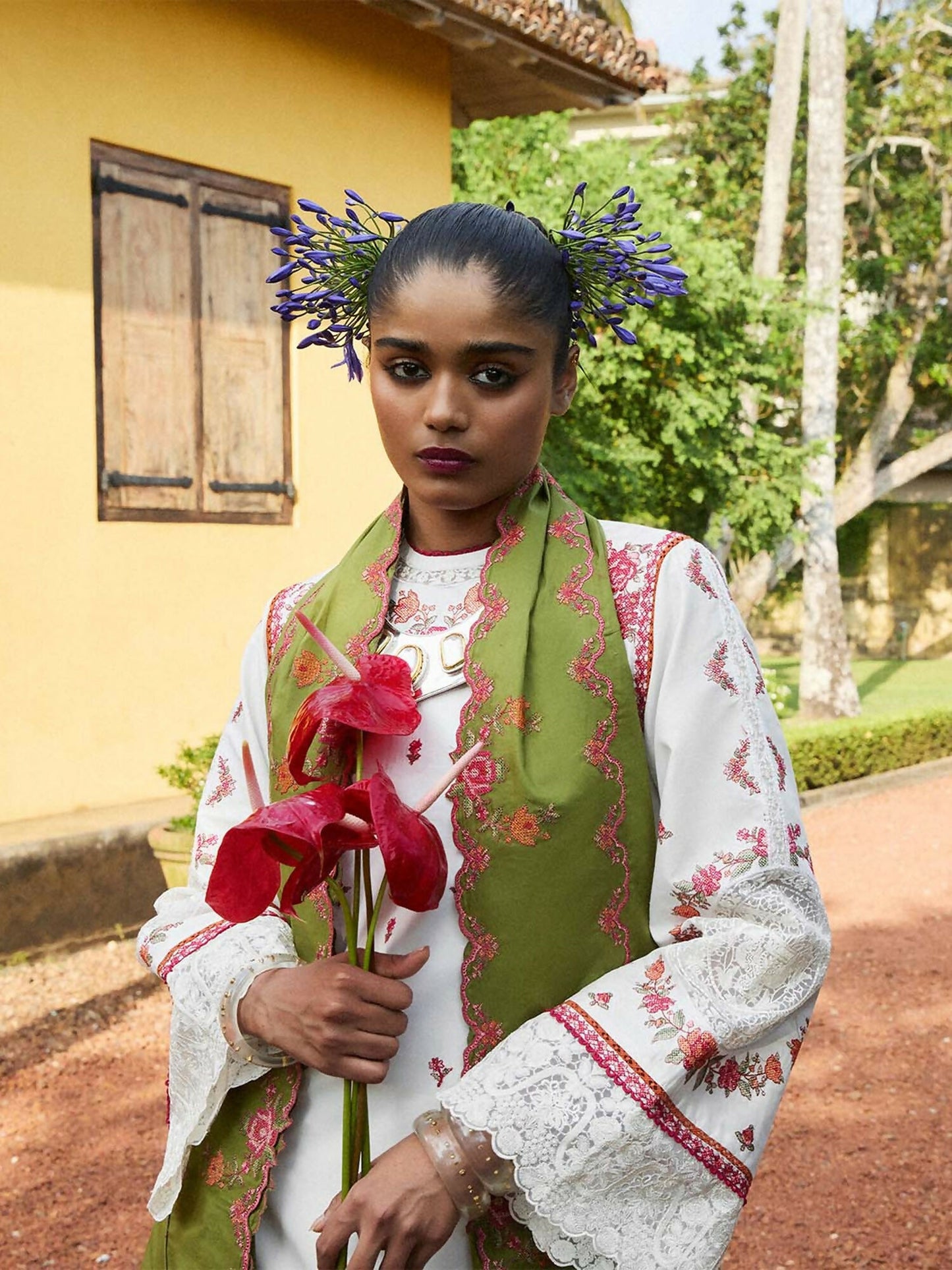 Navya by Hussain Rehar cotton scarf in green, embroidered with multicolor cross-stitch motifs and finished with playful tassels. A timeless accessory blending tradition with contemporary elegance.