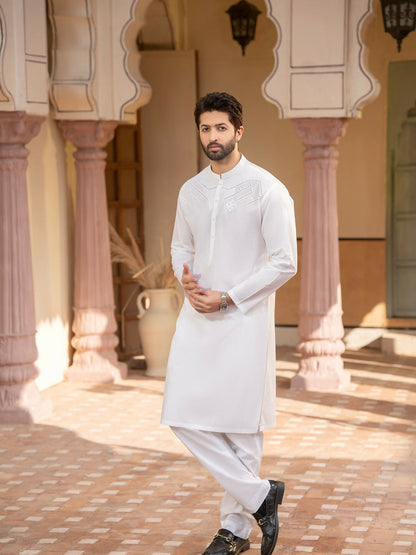 Off-white men’s unstitched kameez shalwar from Miraas by Fabrich, crafted in luxury soft fine 100% cotton, featuring intricate cotton-thread cutwork embroidery on the chest with a signature design pattern — accompanied by designer buttons, inlay card, and branded packaging.