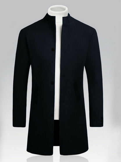 Men’s long wool coat made from imported noble crest wool, featuring a stand collar, two side pockets, and a three-button front closure