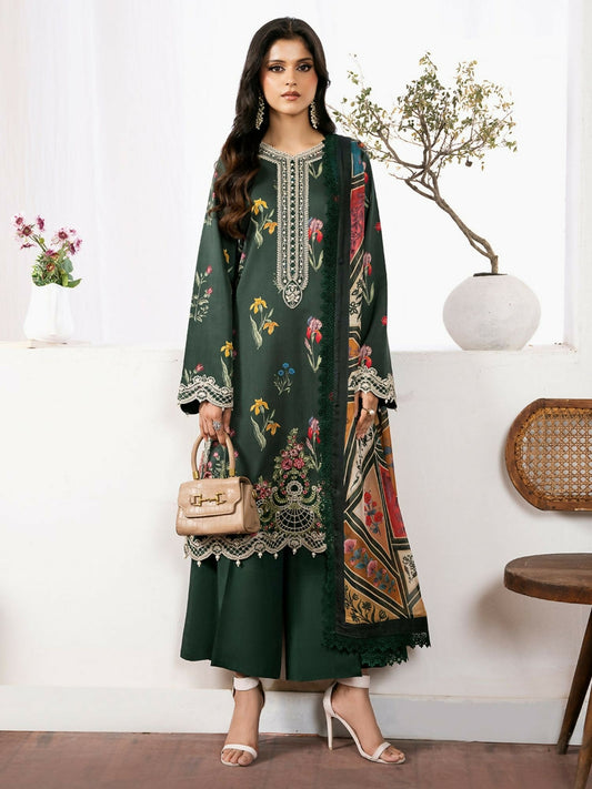 Model wearing an elegant deep emerald green 3-piece unstitched suit with vibrant multicolor floral digital print, intricate embroidered neckline and daman, paired with a printed dupatta and dyed cotton trouser.