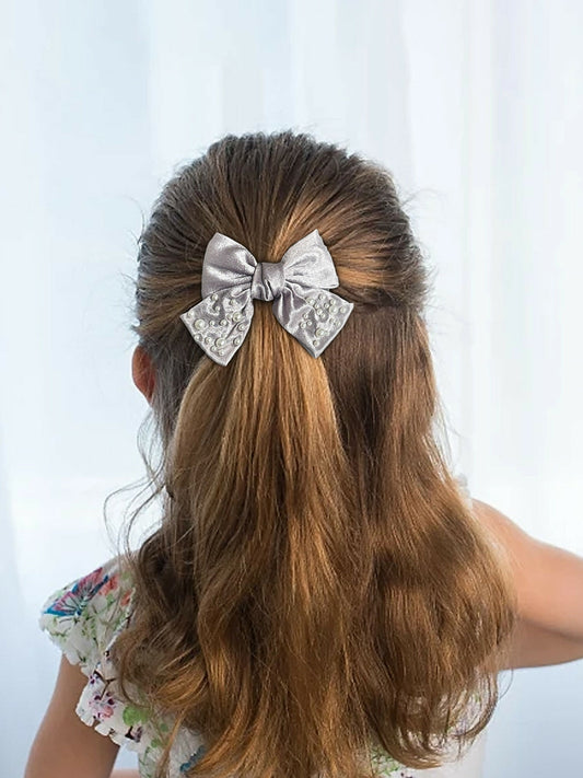 Girl wearing Glitter Jewellery embellished hair bow with delicate pearl details