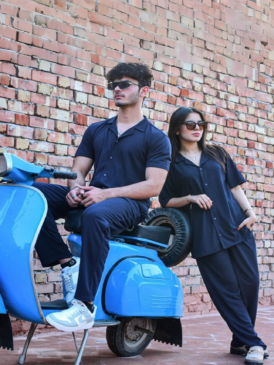 Unisex black French pique coord set with collared shirt and drawstring trousers, ideal for casual everyday wear.