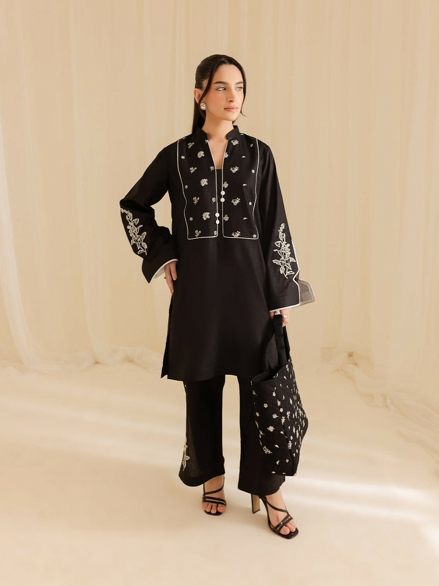 Mahnur stitched 2-piece pret suit with embroidered shirt and embroidered trouser.