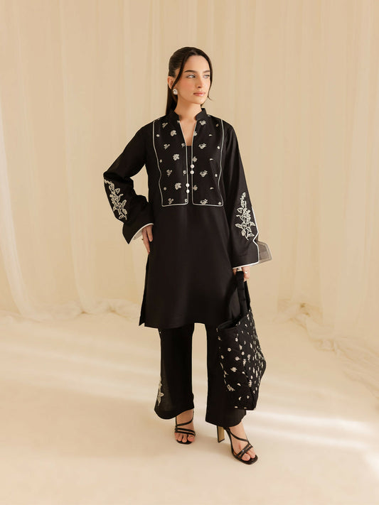 Mahnur stitched 2-piece pret suit with embroidered shirt and embroidered trouser.