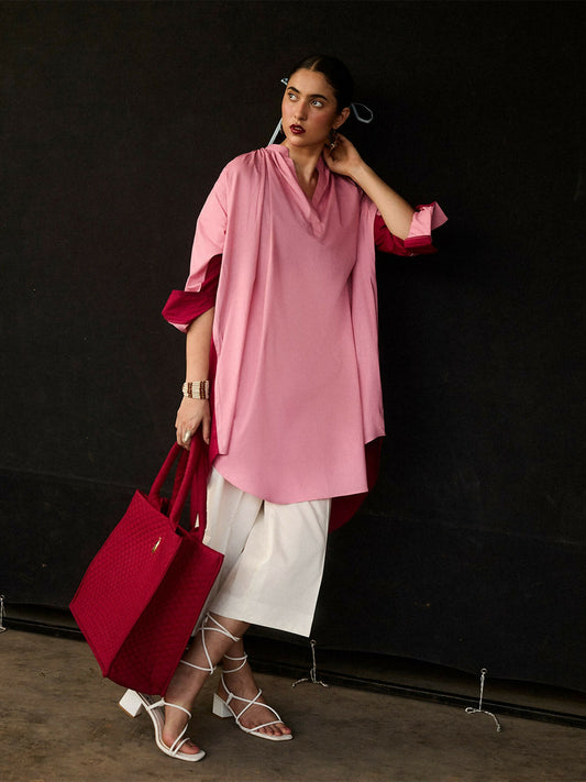 Girl wearing cotton color-blocked pink shirt with band neckline and ivory culottes, stitched 2-piece suit
