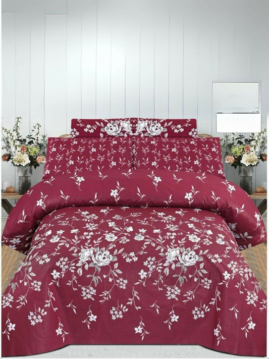 Maroon comforter set with white floral pattern arranged on a double bed, includes matching bedsheet and pillow covers.