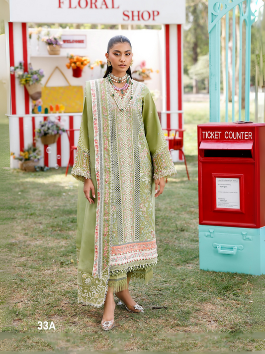 Girl standing wearing unstitched embroidered lawn suit with embroidery on front left and right, organza sleeve motifs, layered daman laces in silk and organza, chiffon dupatta with embroidered pallos and dual-side laces, paired with dyed cotton trouser