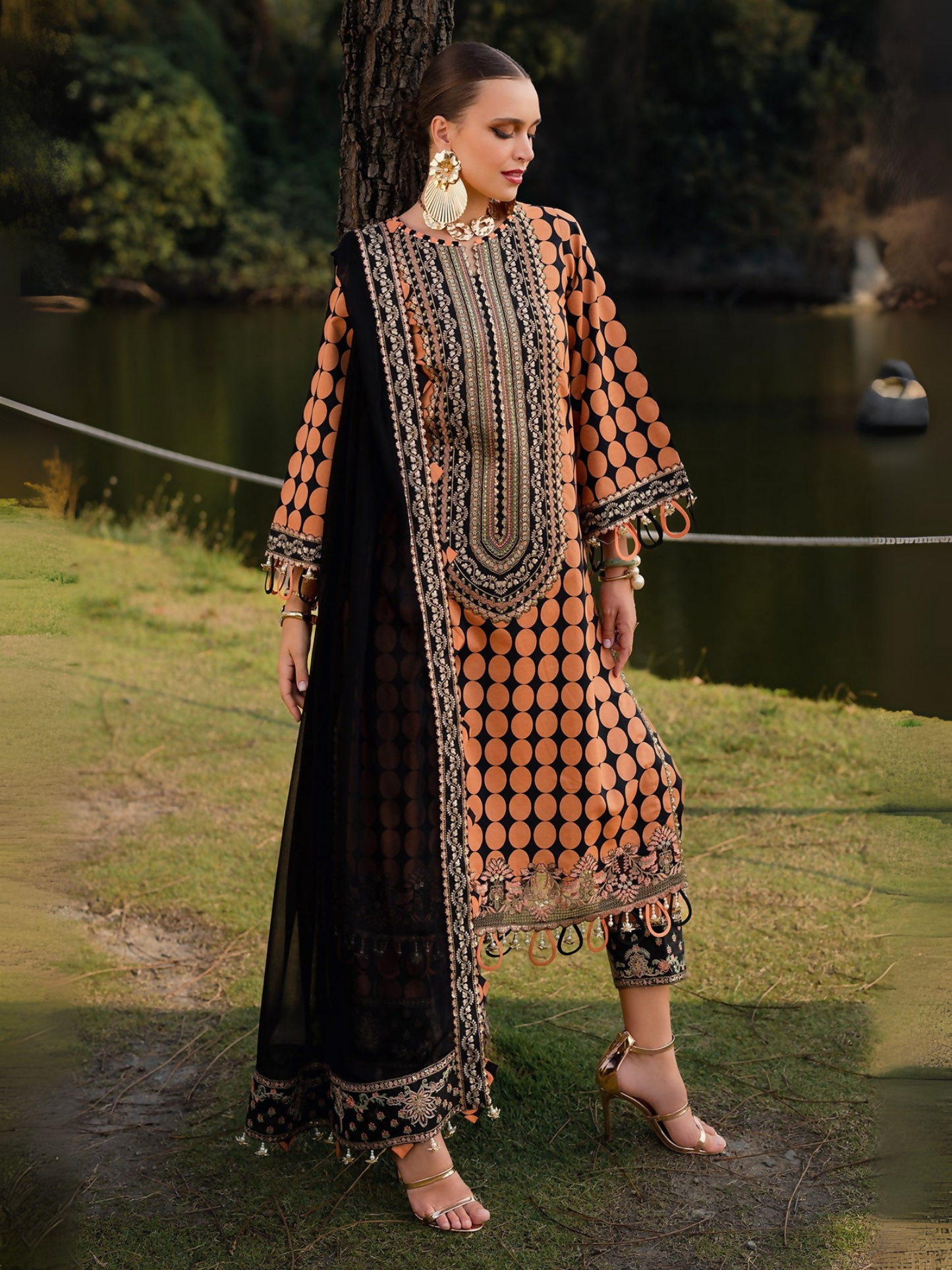 Printed lawn shirt and trouser with embroidered details, back motif, and chiffon dupatta .