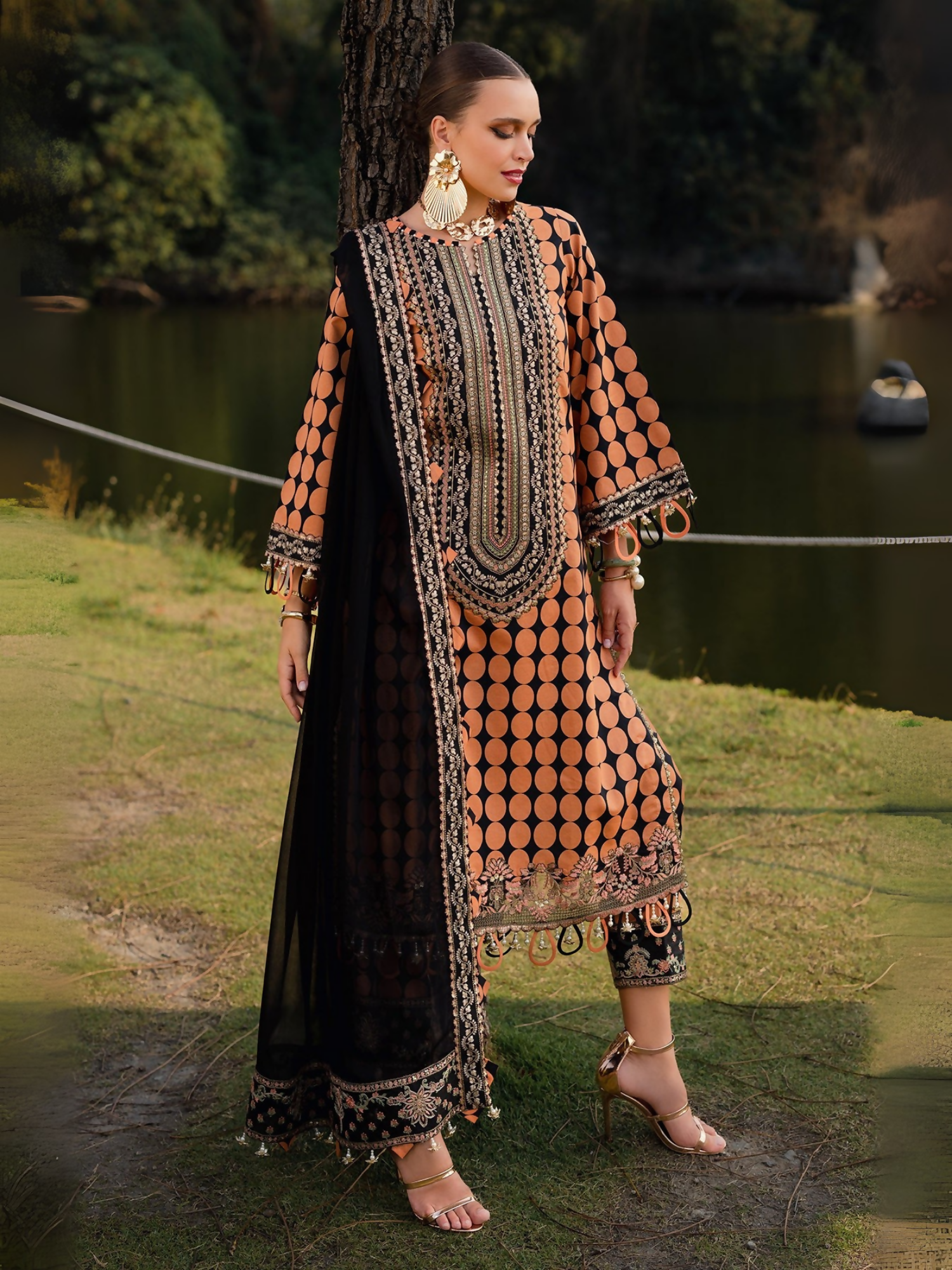 Printed lawn shirt and trouser with embroidered details, back motif, and chiffon dupatta .