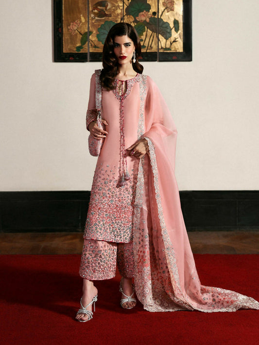 Hussain Rehar stitched 3-piece suit featuring blush pink raw silk embroidered shirt with sequins and hand embellishments, organza dupatta embroidered on all sides, and raw silk culottes with complementing embellishments.