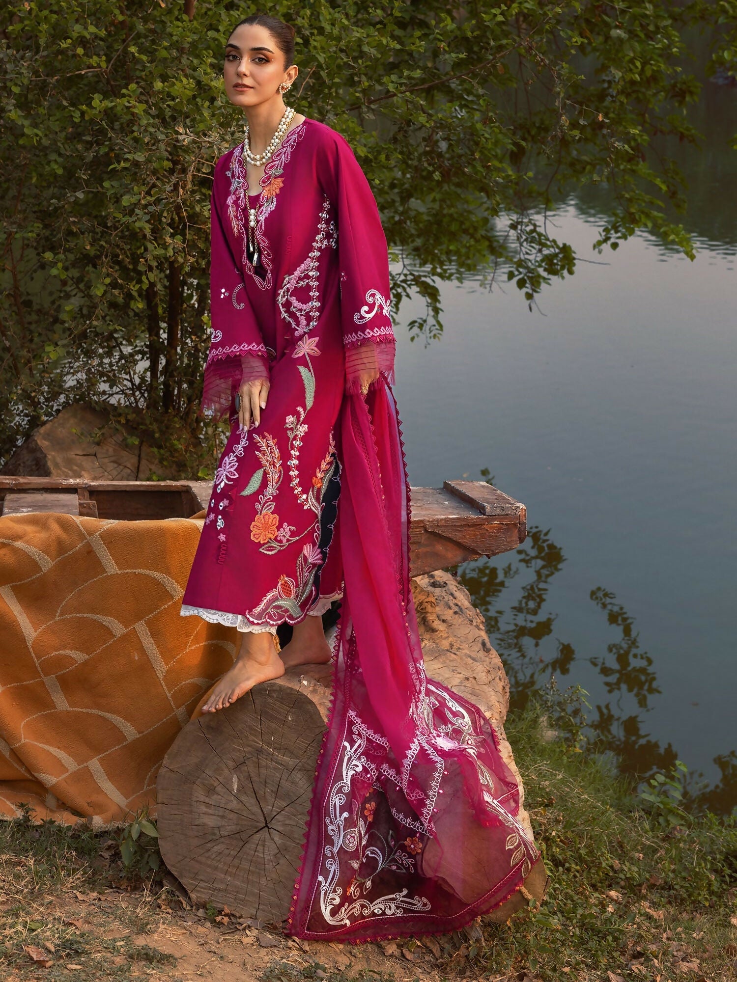 Crimson cherry embroidered outfit with cutwork, mirror work, and asymmetric organza dupatta.