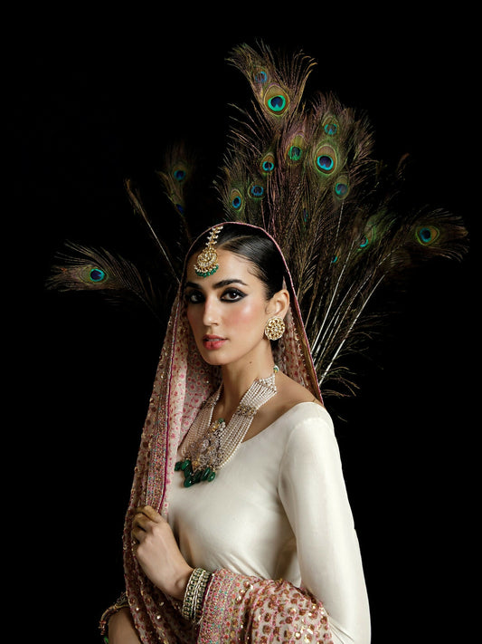Hussain Rehar ivory raw silk shirt with golden embellishments, block printed chiffon sharara, and heavily embellished chiffon dupatta with borders