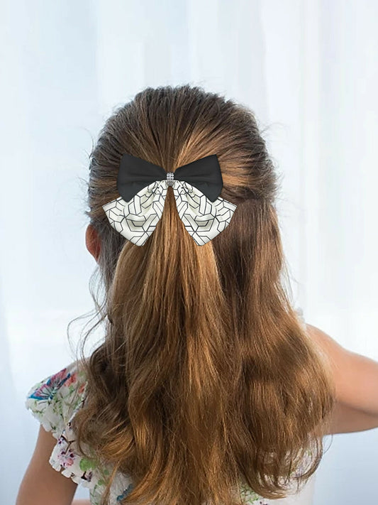 Girl wearing Glitter Jewellery printed hair bow with geometric detailing and rhinestone center
