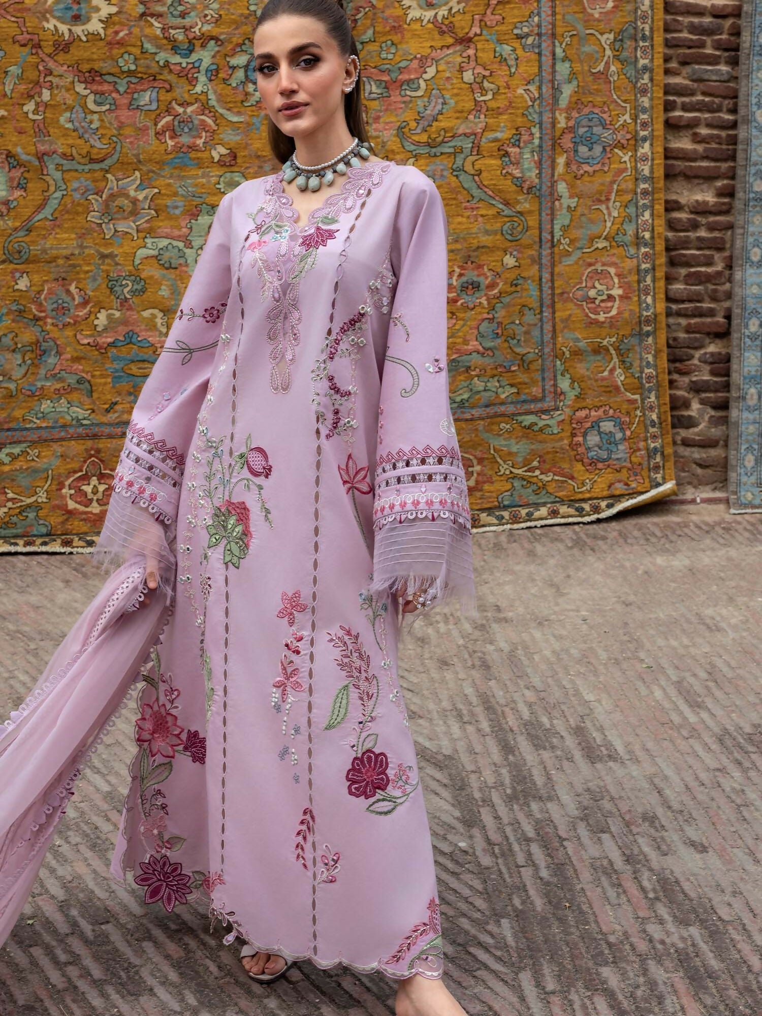 Crimson embroidered outfit with cutwork, mirror work, and asymmetric organza dupatta.