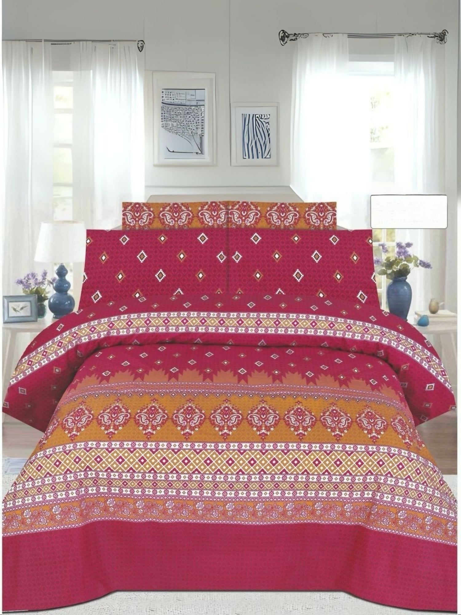 Pink and orange floral comforter set arranged on a bed with matching bedsheet and pillow covers.