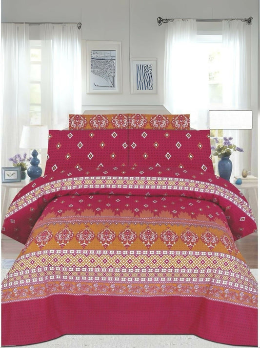Pink and orange floral comforter set arranged on a bed with matching bedsheet and pillow covers.
