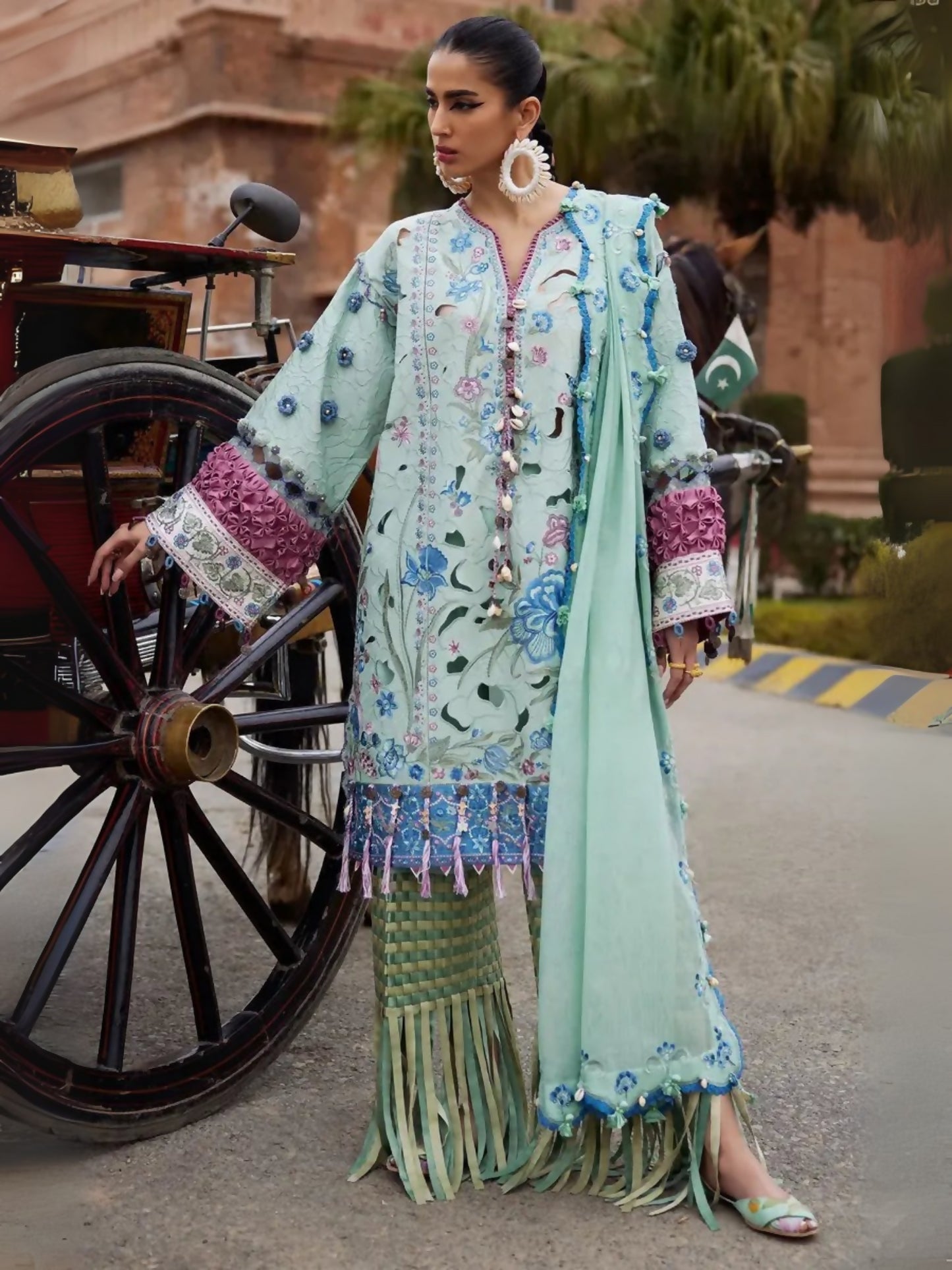 Unstitched 3-piece suit by Elan with embroidered lawn shirt, khaddi net embroidered dupatta, and cambric trouser.