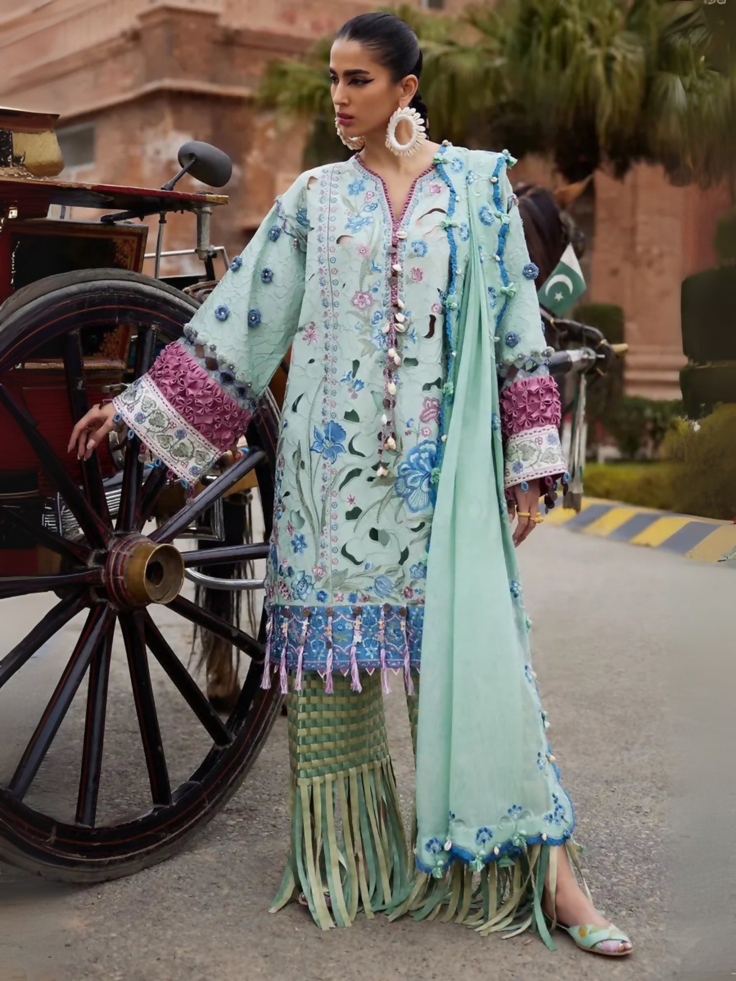 Unstitched 3-piece suit by Elan with embroidered lawn shirt, khaddi net embroidered dupatta, and cambric trouser.
