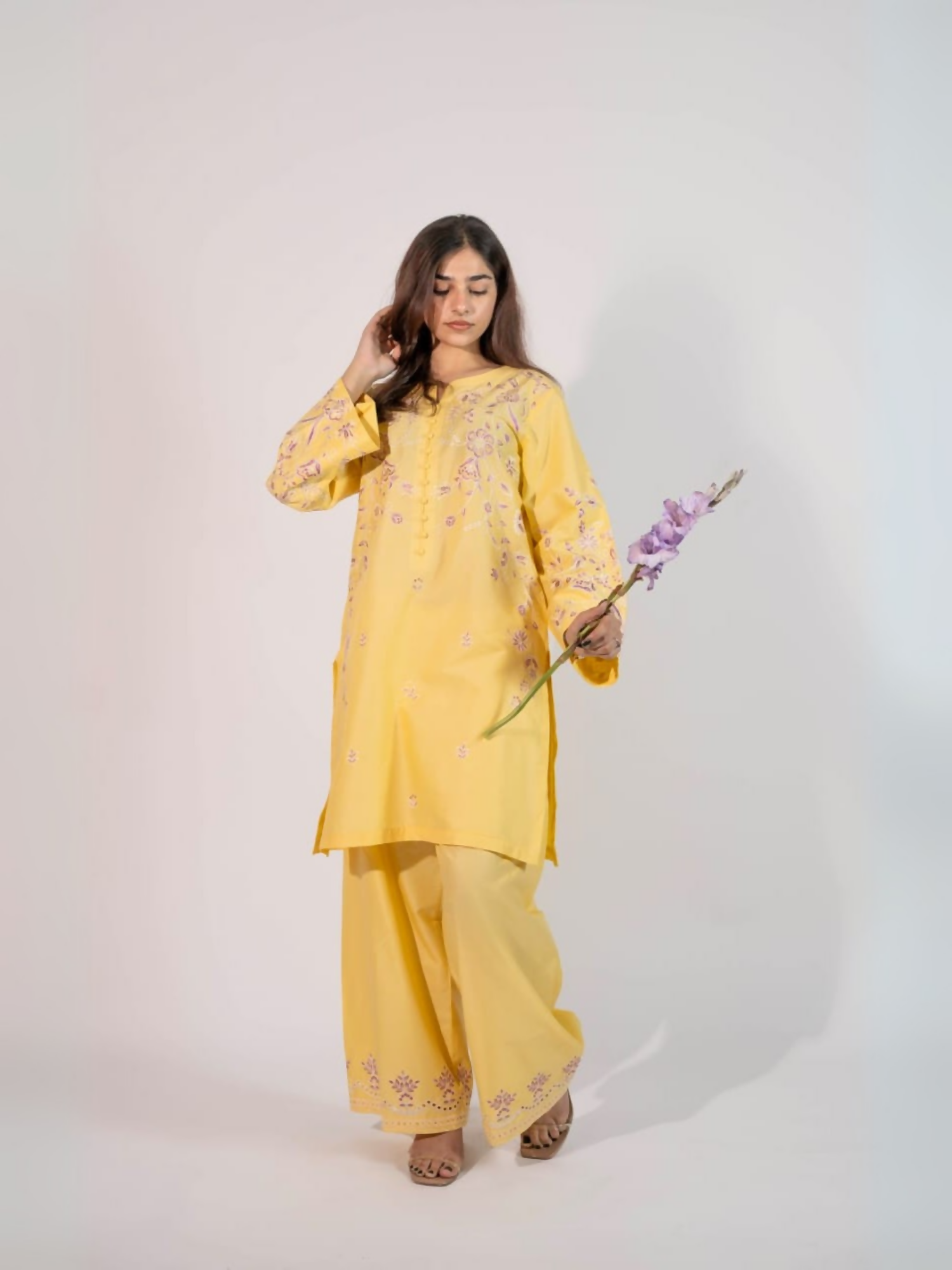 Trends Forever Karam Collection yellow lawn stitched 2-piece suit with embroidered shirt and embroidered trouser, displayed in a bright and elegant setting.